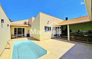 Imagem: A casa possui 3 Dormitórios, 2 Banheiros, 3 Vagas na garagem