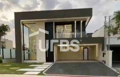 Imagem: A casa possui 4 Dormitórios, 5 Banheiros, 4 Vagas na garagem