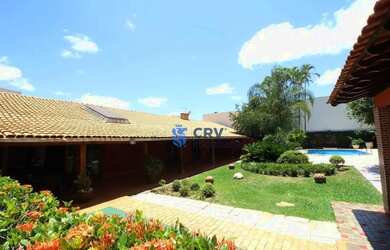 Imagem: A casa possui 4 Dormitórios, 5 Banheiros, 5 Vagas na garagem