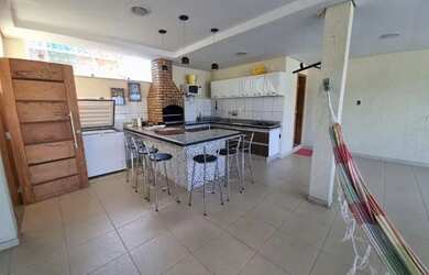 Imagem: A casa possui 4 Dormitórios, 3 Vagas na garagem e está localizado