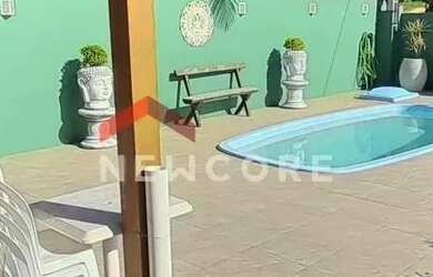 Imagem: A casa possui 4 Dormitórios, 4 Banheiros, 5 Vagas na garagem