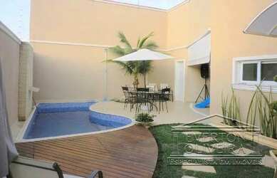 Imagem: A casa possui 4 Dormitórios, 5 Banheiros, 2 Vagas na garagem