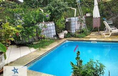 Imagem: A casa em condomínio possui 4 Dormitórios, 5 Banheiros, 5