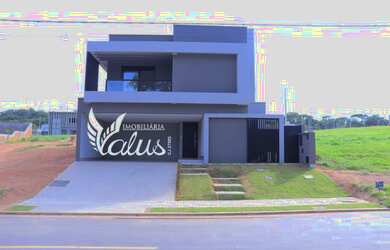 Imagem: A casa possui 4 Dormitórios, 5 Banheiros, 4 Vagas na garagem