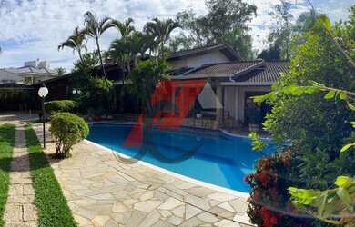 Imagem: A casa em condomínio possui 4 Dormitórios, 5 Banheiros, 4