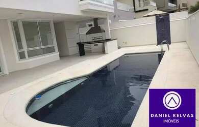 Imagem: A casa possui 5 Dormitórios, 5 Banheiros, 4 Vagas na garagem