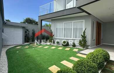 Imagem: A casa possui 3 Dormitórios, 5 Banheiros, 2 Vagas na garagem