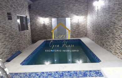 Imagem: A casa possui 2 Dormitórios, 3 Banheiros, 4 Vagas na garagem