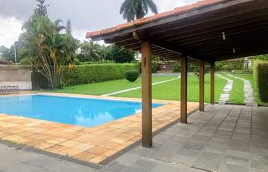 Imagem: A casa possui 5 Dormitórios, 5 Banheiros, 5 Vagas na garagem