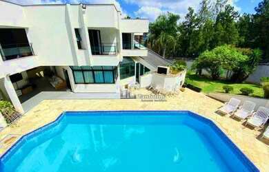 Imagem: A casa em condomínio possui 4 Dormitórios, 5 Banheiros, 5