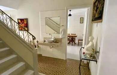 Imagem: A casa possui 3 Dormitórios, 3 Banheiros, 3 Vagas na garagem