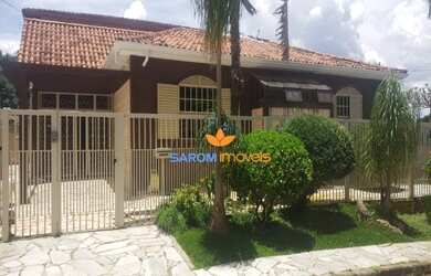 Imagem: A casa possui 4 Dormitórios, 4 Banheiros, 5 Vagas na garagem