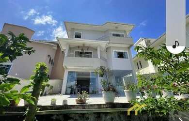 Imagem: A casa possui 3 Dormitórios, 5 Banheiros, 5 Vagas na garagem