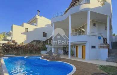 Imagem: A casa em condomínio possui 5 Dormitórios, 5 Banheiros, 4