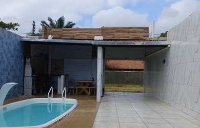 Imagem: A casa possui 3 Dormitórios, Acomodam 11 pessoas, 3 Vagas na