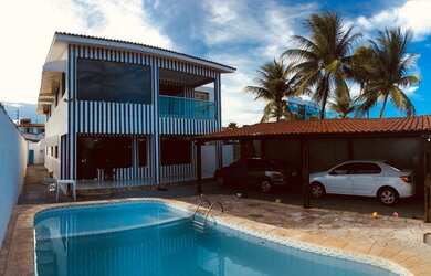 Imagem: A casa possui 4 Dormitórios, 3 Banheiros, 3 Vagas na garagem