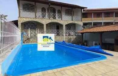 Imagem: A casa possui 5 Dormitórios, 4 Banheiros, 5 Vagas na garagem