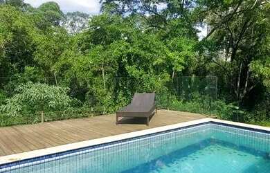 Imagem: A casa possui 4 Dormitórios, 5 Banheiros, 5 Vagas na garagem