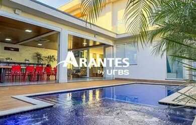 Imagem: A casa possui 4 Dormitórios, 5 Banheiros, 5 Vagas na garagem