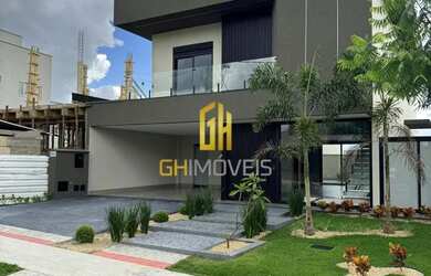 Imagem: A casa possui 4 Dormitórios, 5 Banheiros, 4 Vagas na garagem