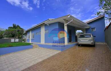 Imagem: A casa possui 3 Dormitórios, 3 Banheiros, 3 Vagas na garagem