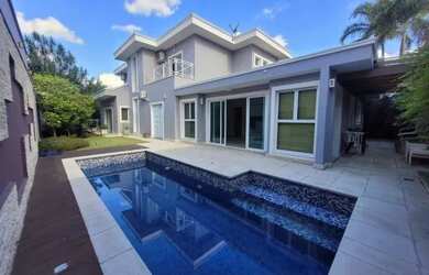 Imagem: A casa em condomínio possui 4 Dormitórios, 5 Banheiros, 5