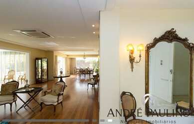 Imagem: A casa em condomínio possui 4 Dormitórios, 4 Banheiros, 509m²