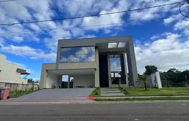 Imagem: A casa possui 5 Dormitórios, 5 Banheiros, 4 Vagas na garagem