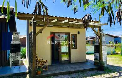 Imagem: A casa possui 3 Dormitórios, 3 Banheiros, 3 Vagas na garagem