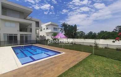 Imagem: A casa possui 4 Dormitórios, 5 Banheiros, 4 Vagas na garagem