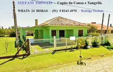 Imagem: A casa possui 3 Dormitórios, 2 Banheiros, 3 Vagas na garagem