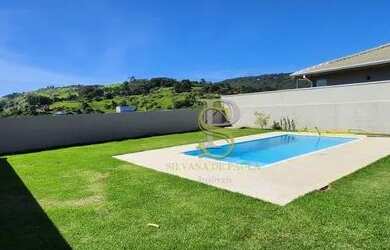 Imagem: A casa possui 3 Dormitórios, 5 Banheiros, 2 Vagas na garagem