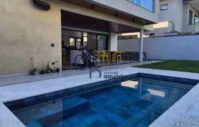 Imagem: A casa em condomínio possui 5 Dormitórios, 5 Banheiros, 4