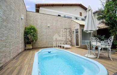 Imagem: A casa possui 3 Dormitórios, 5 Banheiros, 5 Vagas na garagem