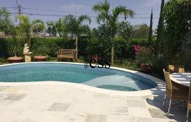 Imagem: A casa em condomínio possui 4 Dormitórios, 4 Banheiros, 4