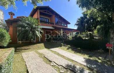 Imagem: A casa em condomínio possui 5 Dormitórios, 5 Banheiros, 420m²