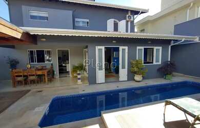 Imagem: A casa possui 4 Dormitórios, 4 Banheiros, 4 Vagas na garagem