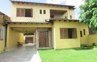 Imagem: A casa possui 3 Dormitórios, 2 Banheiros, 1 Vaga na garagem