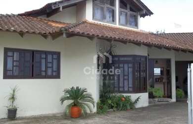 Imagem: A casa à venda possui 3 Dormitórios, 3 Banheiros, 2 Vagas