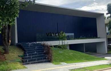 Imagem: A casa possui 4 Dormitórios, 5 Banheiros, 5 Vagas na garagem