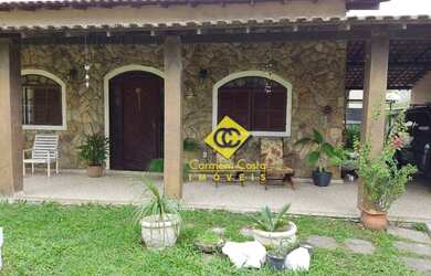 Imagem: A casa possui 3 Dormitórios, 4 Banheiros, 5 Vagas na garagem