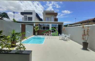 Imagem: A casa possui 4 Dormitórios, 5 Banheiros, 180m² de Área e