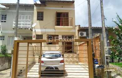 Imagem: A casa possui 3 Dormitórios, 2 Banheiros, 2 Vagas na garagem