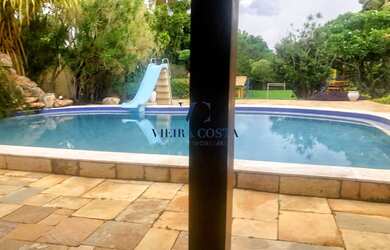 Imagem: A casa possui 5 Dormitórios, 5 Banheiros, 3 Vagas na garagem