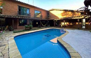 Imagem: A casa possui 3 Dormitórios, 4 Banheiros, 4 Vagas na garagem