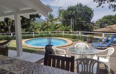 Imagem: A casa possui 3 Dormitórios, 3 Vagas na garagem e está localizado