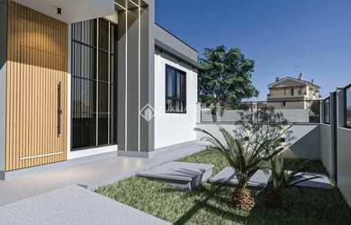 Imagem: A casa possui 3 Dormitórios, 2 Banheiros, 2 Vagas na garagem