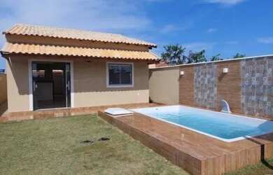 Imagem: A casa possui 3 Dormitórios, 2 Banheiros, 3 Vagas na garagem