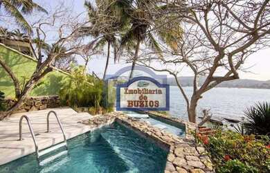 Imagem: A casa possui 5 Dormitórios, 5 Banheiros, 4 Vagas na garagem