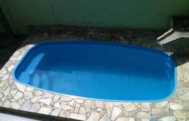 Imagem: A casa possui 2 Dormitórios, Acomodam 8 pessoas, 2 Vagas na